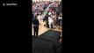 Woman born with cerebral palsy walks to stage during graduation ceremony