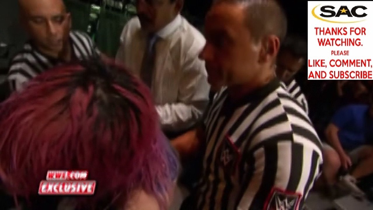 Officials tend to Asuka and Nikki Cross after crashing through table_ NXT Exclusive, June 14, 2017