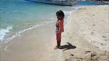 Baby Playing Star Fish and Beach Sand - Donna The