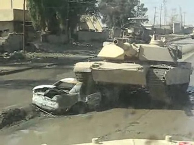 Tank rolls over a car bomb