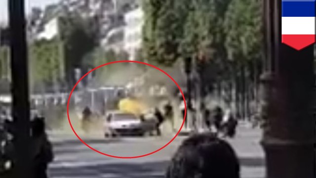 Explosives-laden car rams into police van on Champs-Elysees