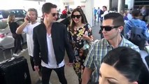 495.X17 EXCLUSIVE - Miranda Kerr And Evan Spiegel Hold Hands And Smile Big About Marriage At LAX