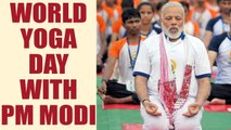 PM Modi braves rain to attend World Yoga day in Lucknow with 51,000 participants | Oneindia News