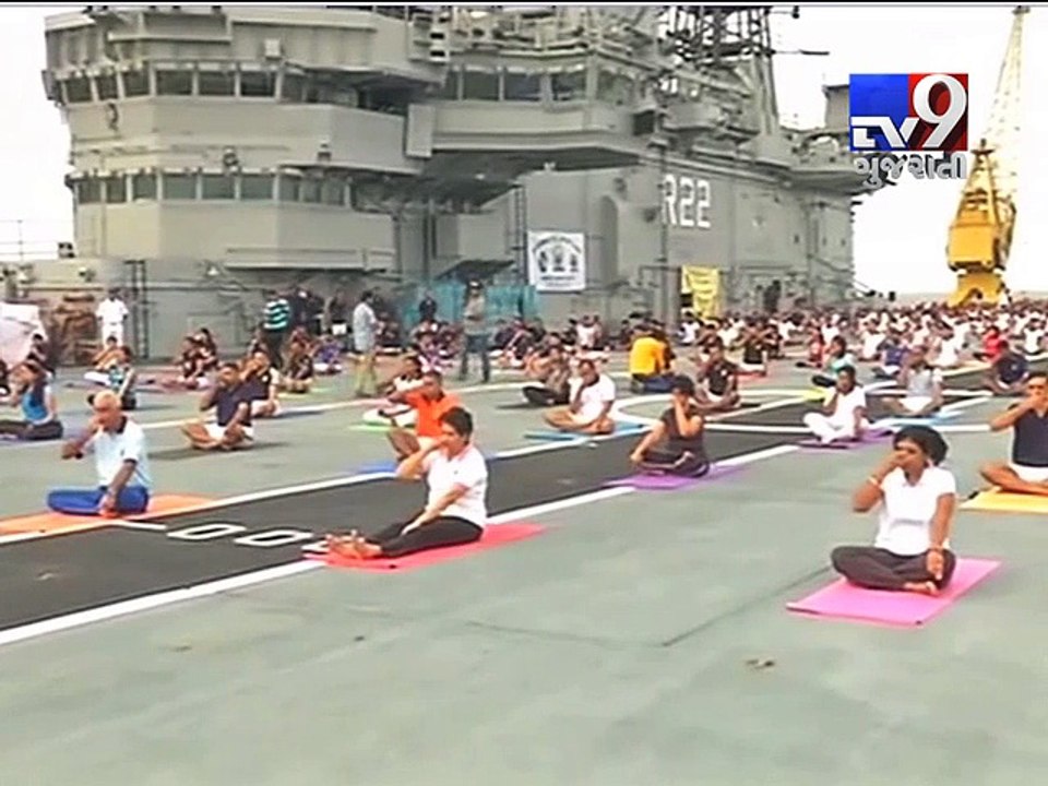 Navy personnel, families perform asanas atop INS Viraat on Yoga day - Tv9