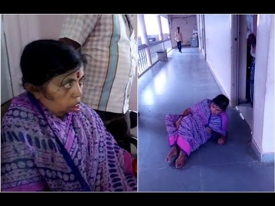 handicapped woman crawls on floor to reach taluk office for adharcard