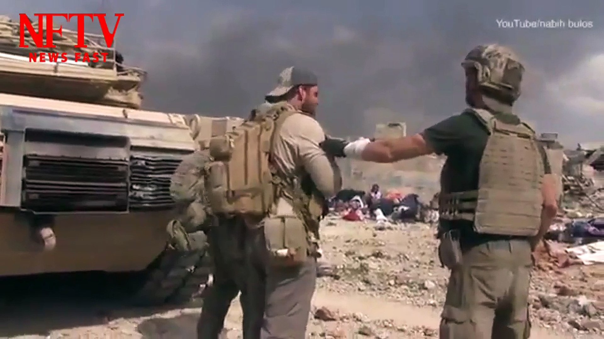 Amazing moment #US aid worker runs through #ISIS gunfire in #Mosul to rescue little girl