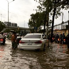 Motorists Negotiate Flooded Streets of Ho Chi Minh City