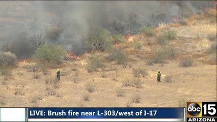 Air15 over a brush fire near the Loop 303 and I-17
