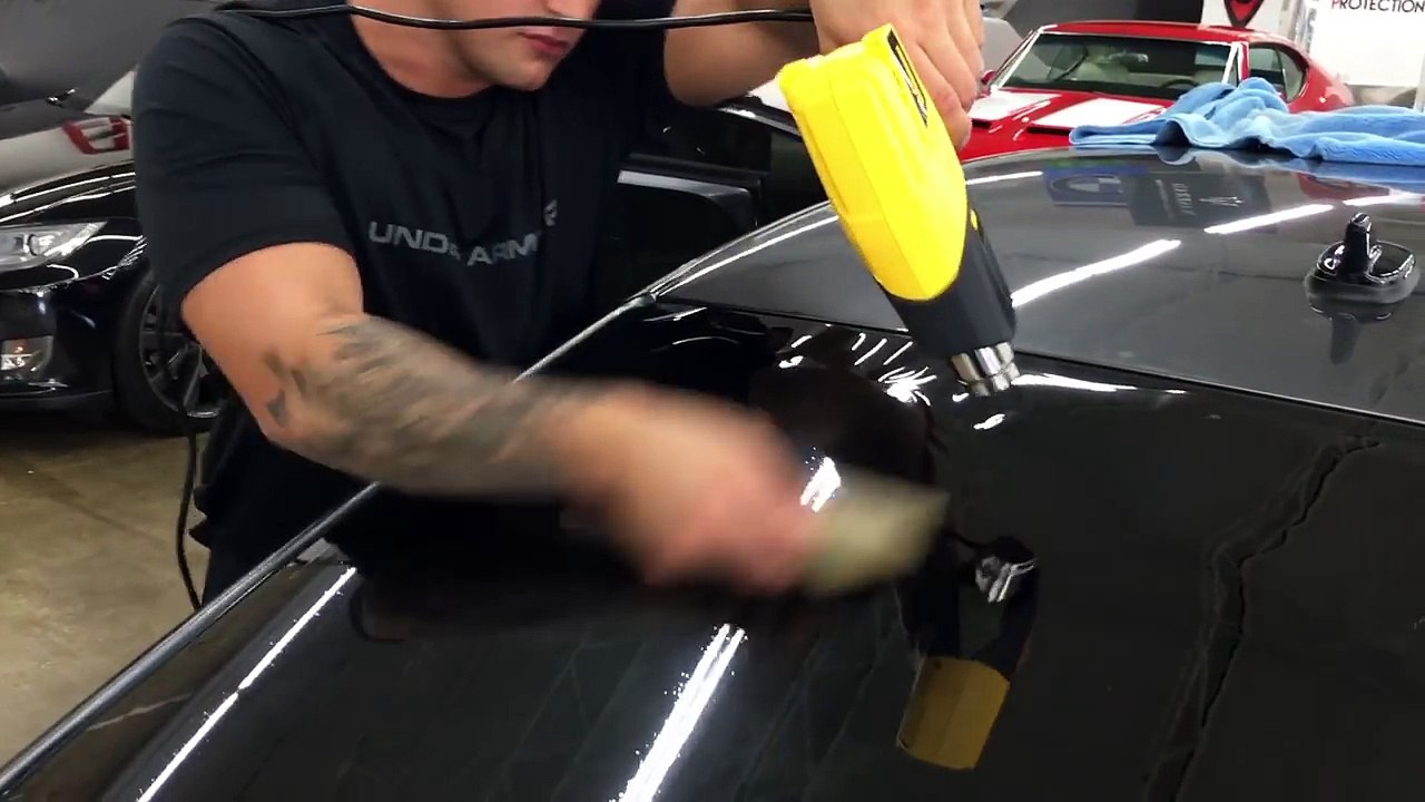 Heat shrinking  rear window tint within