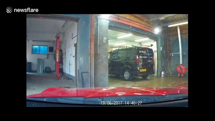 Dash-cam records car mechanic appreciating air conditioning on hot day