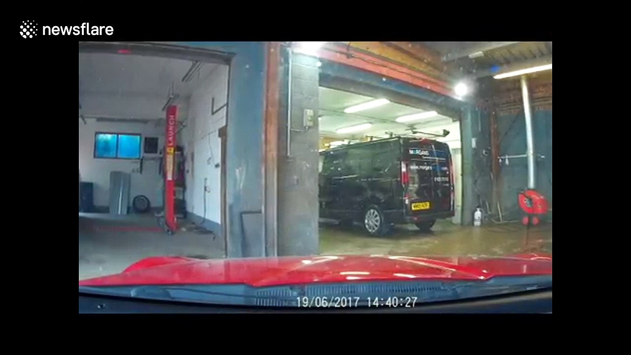 Dash-cam records car mechanic appreciating air conditioning on hot day