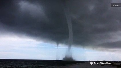Three waterspouts whip up off the Florida coast as Cindy makes landfall