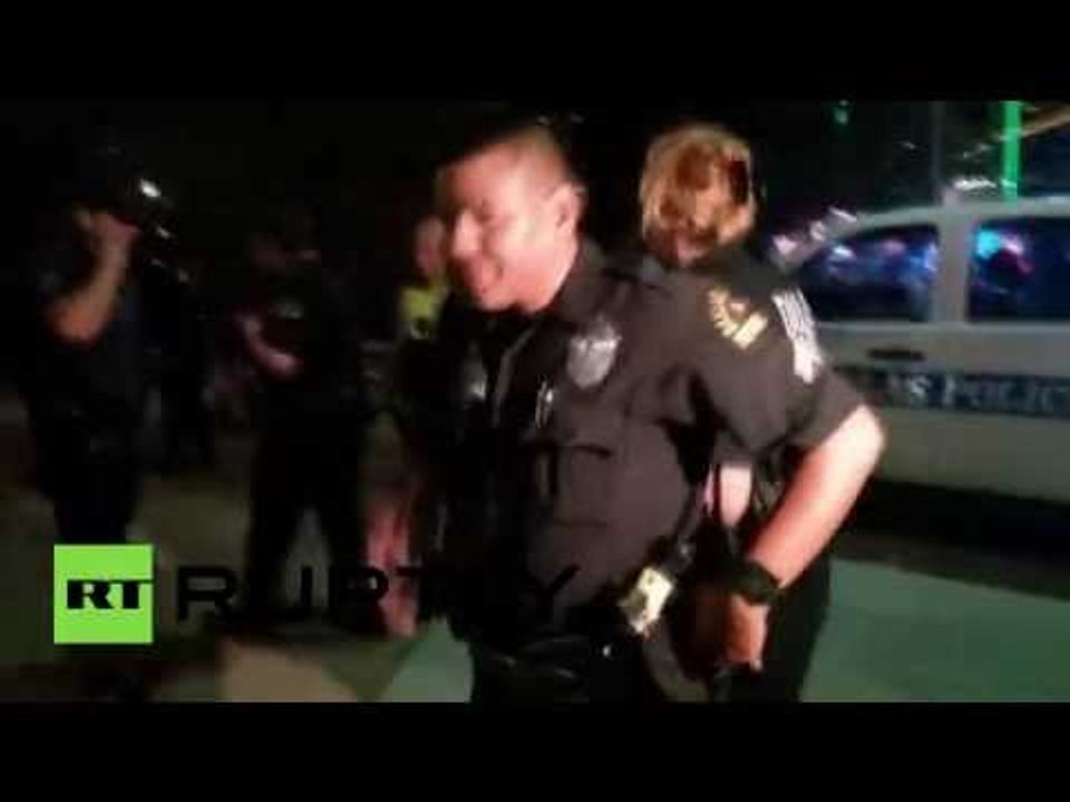 Police arrest man as they look for suspects in Dallas shootings