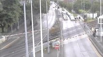 Moment a man risked his life on a level crossing