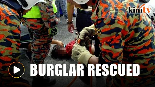 Burglar trapped on rooftop 'rescued' by Bomba