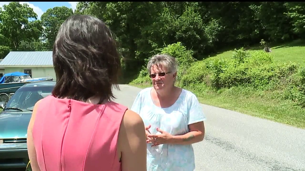 Woman Killed by Stray Bullet While Riding in Car with Husband