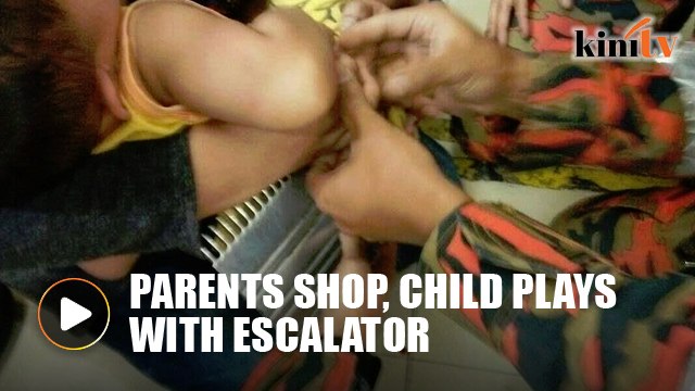 Two-year-old boy plays near escalator while parents shop, gets fingers stuck