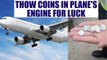 Chinese woman throws coins inside plane's engine for good-luck | Oneindia News