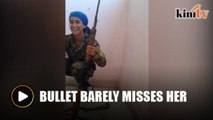 Woman laughs after IS sniper misses her head