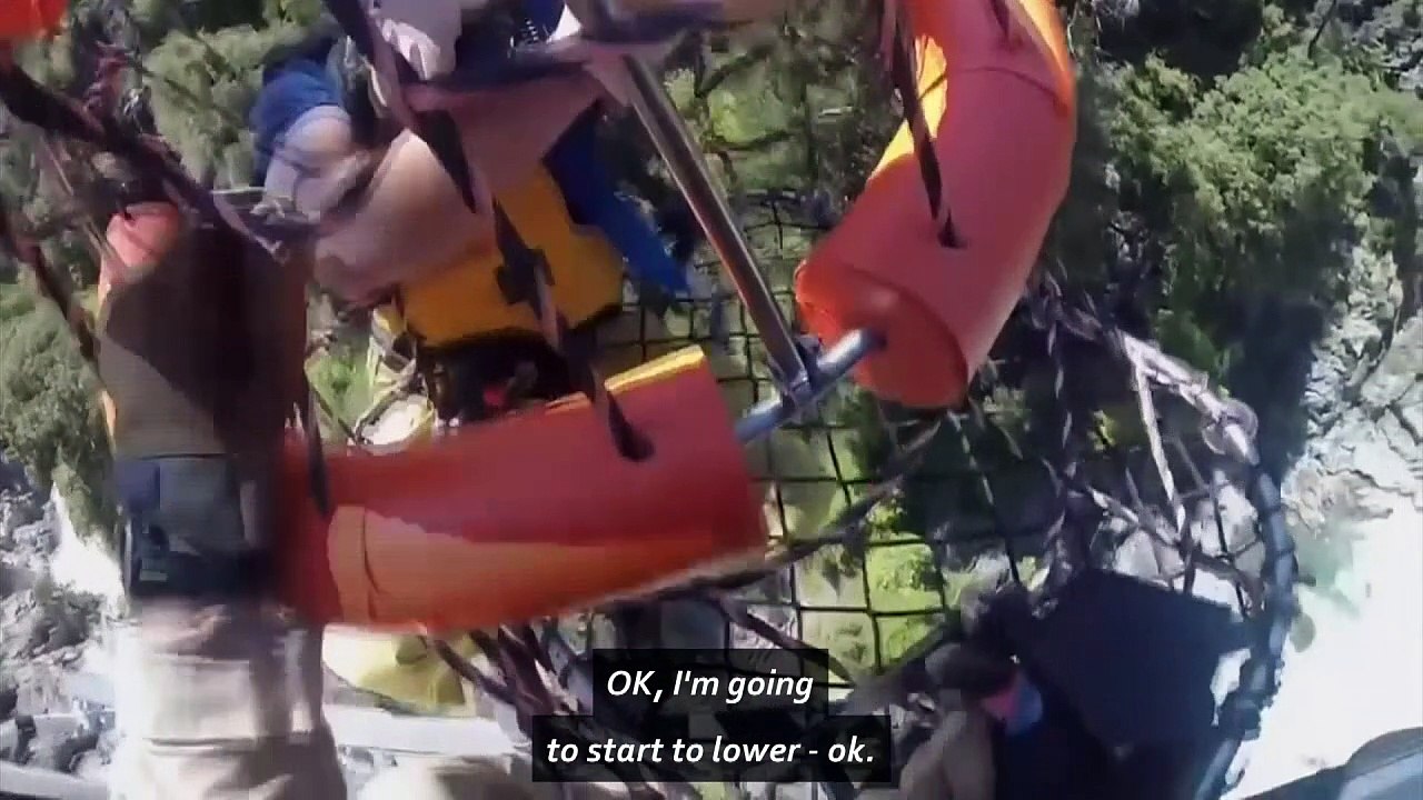 Helicopter rescue of man stranded above 50 foot waterfall