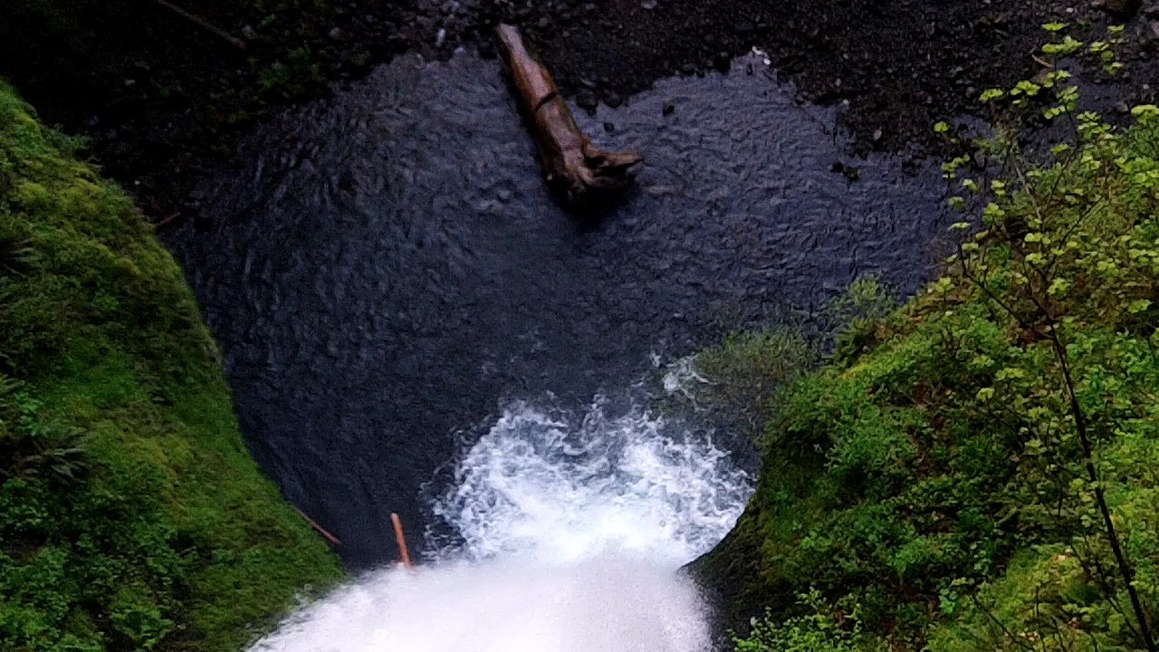 A waterfall is a place where water flows over a vertical drop or a series of drops in the course of a stream or river
