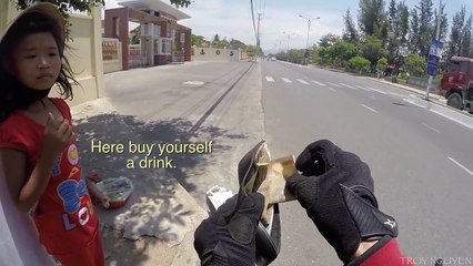 Buying water for a poor girl in Nha Trang. Vietnam.