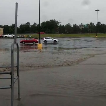 Parking Lots, Streets Under Water After Inches of Rain in Utica