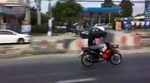 Man Uses Phone While Riding Motorbike Cross-legged