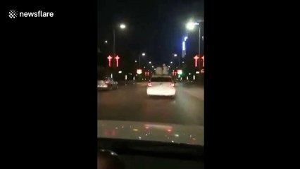 Man comforts woman on top of moving car after she broke up with her boyfriend