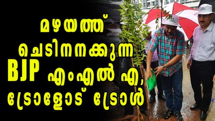 Photo Of BJP MLA Watering Plants During Rain Goes Viral | Oneindia Malayalam