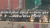 Venezuelan police fire tear gas inside Caracas malls