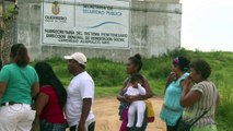 Relatives of inmates try to see their loved ones after riot