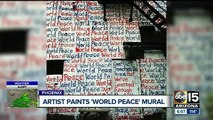 Mural artist painting for world peace