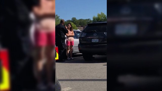 Police officer filmed yelling at mother for leaving children in hot car