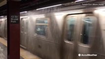 Rain pours onto New York City subway cars