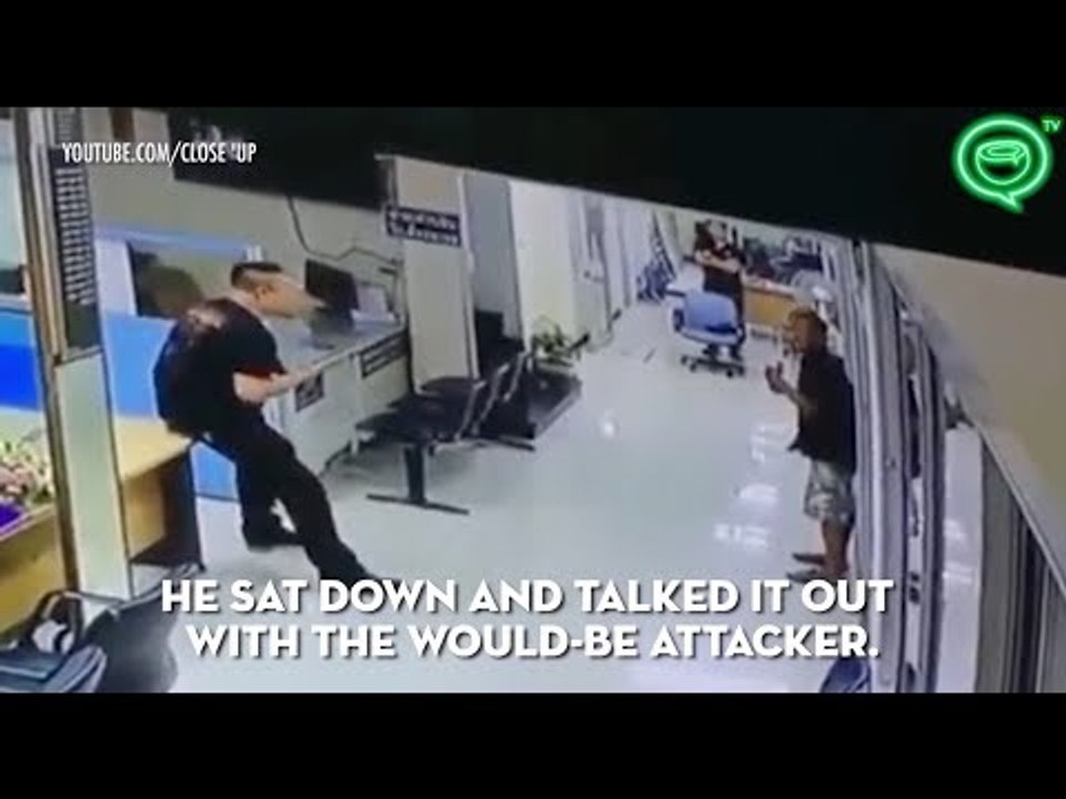 Thai police officer disarms man with knife with a hug | Coconuts TV