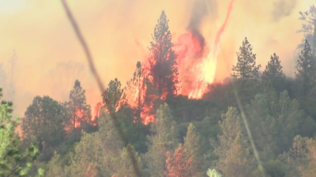 Firefighters work to contain wildfires throughout California