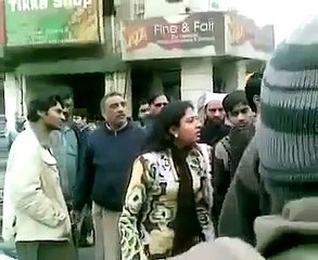 woman fighting with man  and abusing on the road