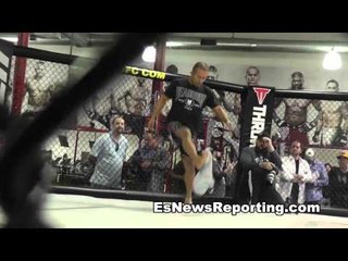 mma fighter ivan menjirar works out kicking a bag