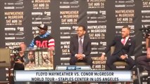 Floyd Mayweather Shows Off $100,000,000 Check In McGregor's Face