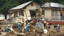 Japan floods: PM Shinzo Abe visits worst affected areas