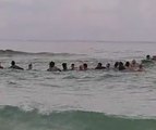 Dramatic Video Shows Strangers Form 'Human Chain' to Save Family Trapped in Rip Tide