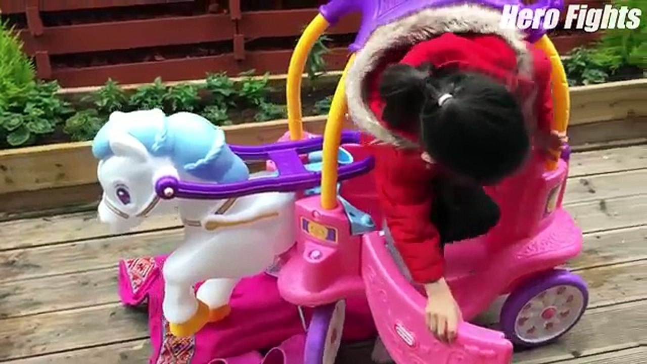 Baby Minnie playing with her new pink horse carriage by little tikes