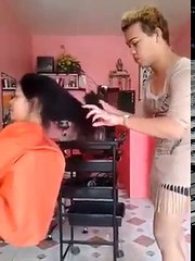 philipino girl getting her long hair cut off