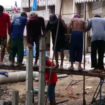 Le travail en commun de cette équipe d'ouvriers