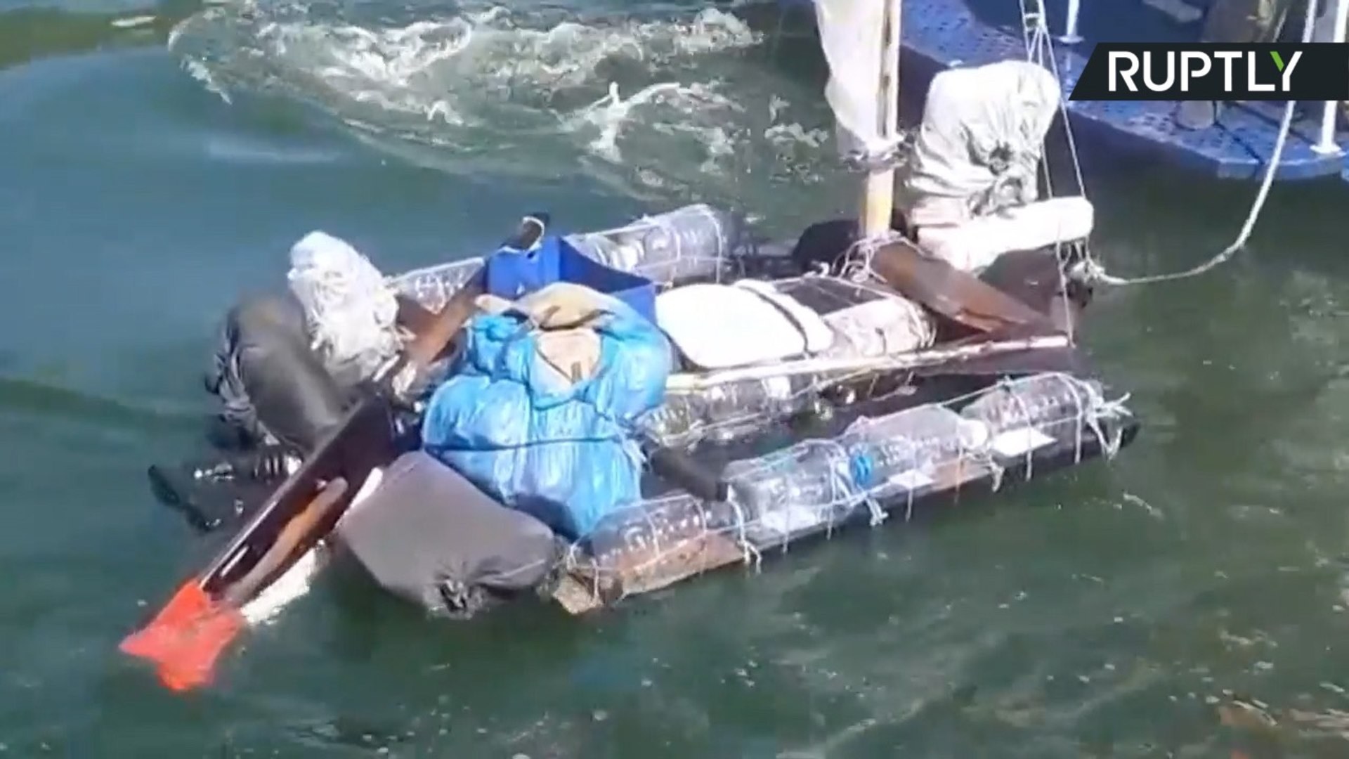 ⁣Budget Travel? Coast Guard Arrest Man Sailing on Raft Made of Plastic Bottles