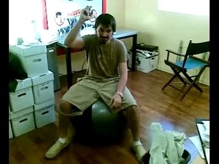 A Man Pops the Balloon Chair He is Sitting On