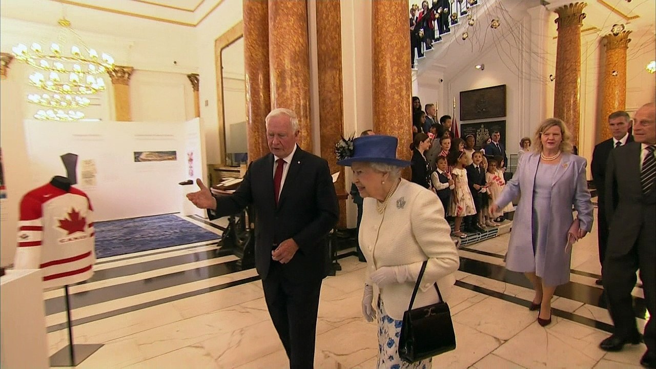 Governor General breaks royal protocol by touching the Queen