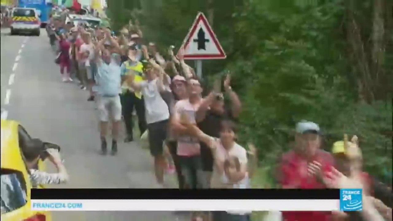 Tour de France caravan showers fans with gifts
