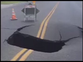 Moment sinkhole swallows huge segment of road in California